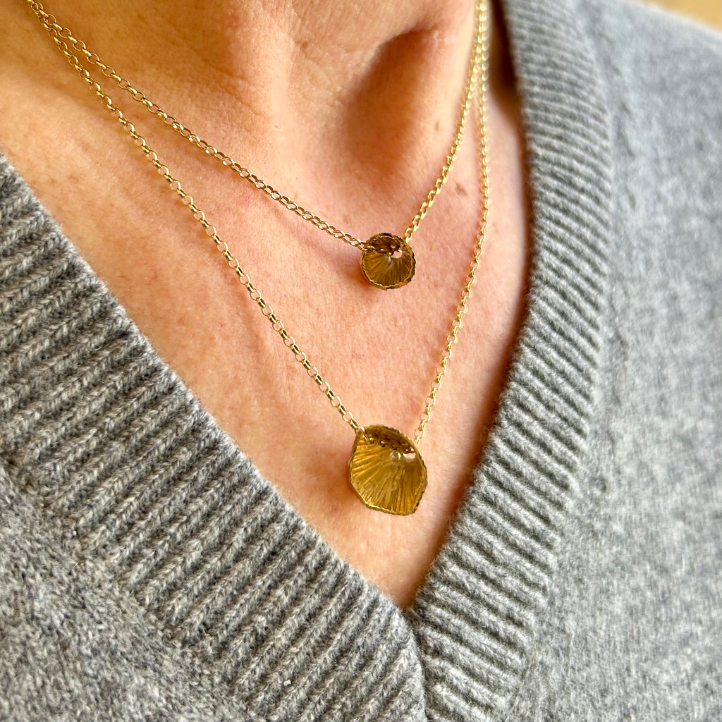 Photograph 1 of Martina Hamilton's 9k Yellow Gold Shell Cone Pendant. Available on DESIGNYARD.com and in our Jewellery Shop Dublin, Ireland. Free Worldwide Shipping with DHL.