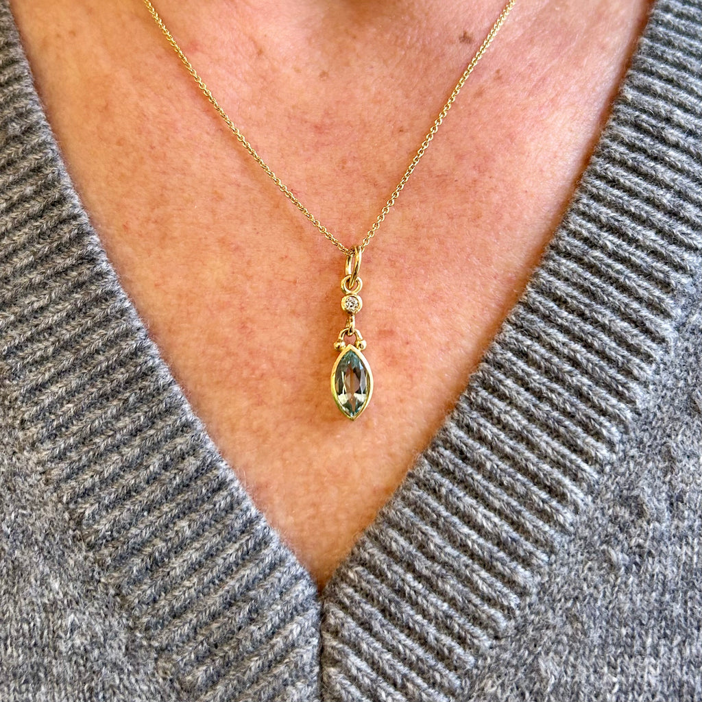 Photograph 3 of Cassie McCann's 18k Yellow Gold Aquamarine Diamond Pendant. Available on DESIGNYARD.com and in our Jewellery Shop Dublin, Ireland. Free Worldwide Shipping with DHL.