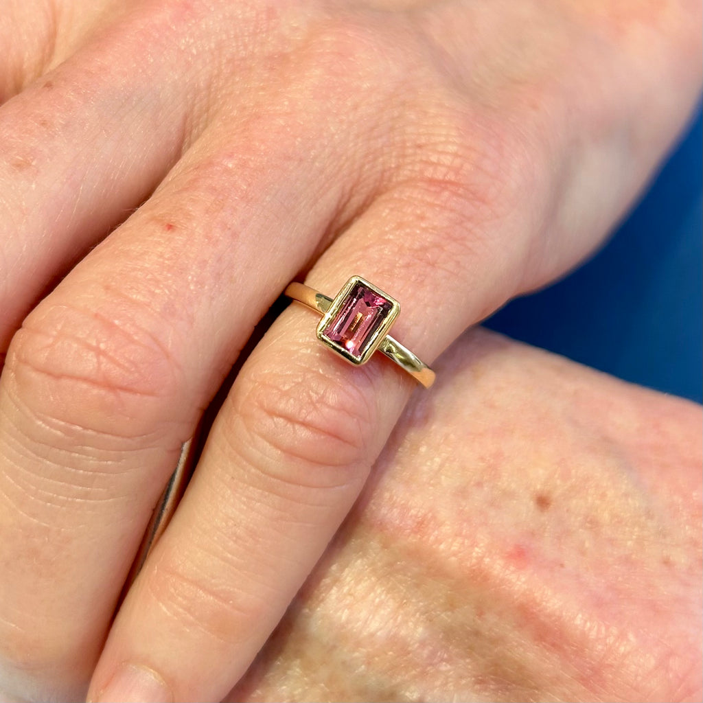Photograph 2 of Ronan Campbell's 18k Yellow Gold Mēdēəm Bezəl Pink Tourmaline Petite Ring. Available on DESIGNYARD.com and in our Jewellery Shop Dublin, Ireland. Free Worldwide Shipping with DHL.