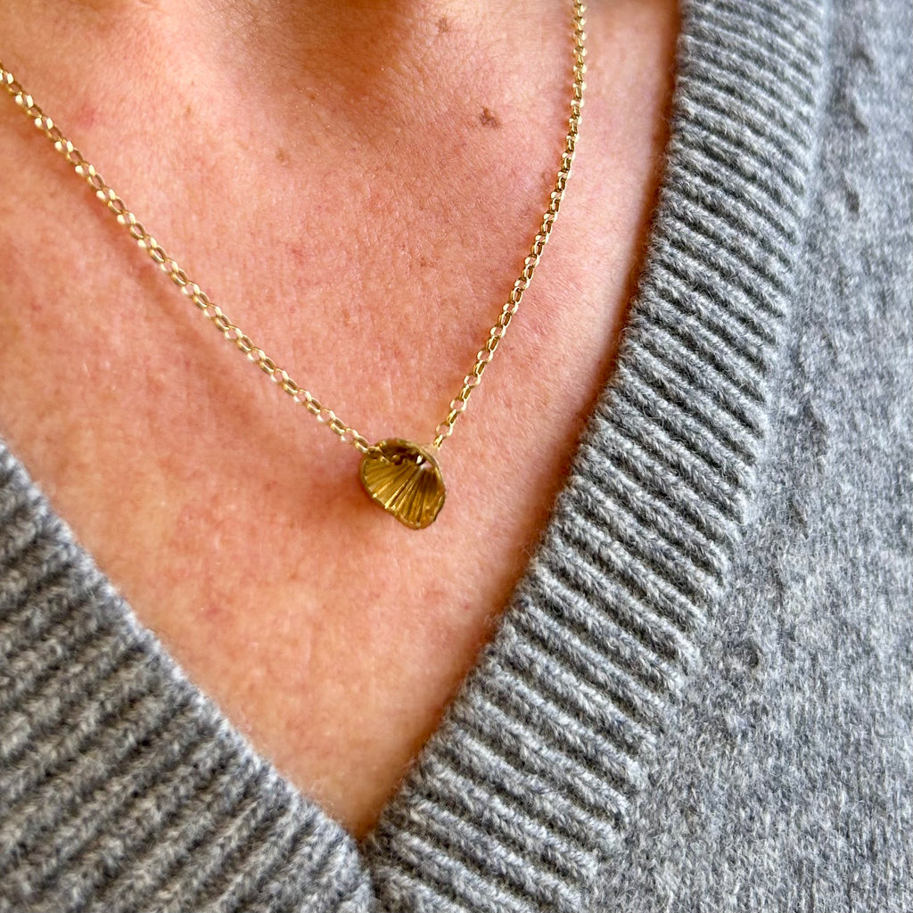 Photograph 3 of Martina Hamilton's 9k Yellow Gold Shell Cone Small Pendant. Available on DESIGNYARD.com and in our Jewellery Shop Dublin, Ireland. Free Worldwide Shipping with DHL.