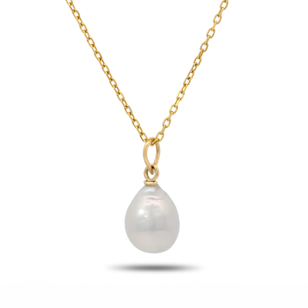 Photograph 1 of Cassie McCann's 9k Yellow Gold Baroque Pearl Pendant. Available on DESIGNYARD.com and in our Jewellery Shop Dublin, Ireland.