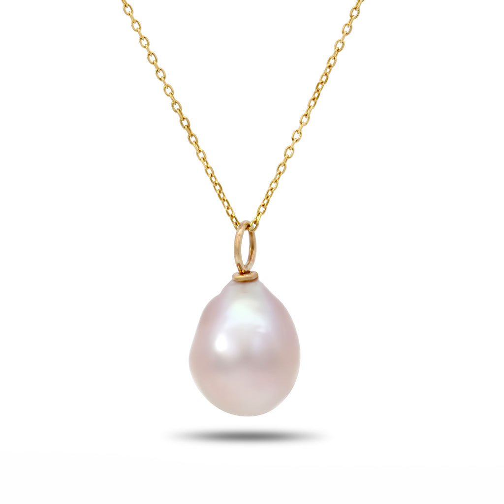 Photograph 1 of Cassie McCann's 9k Yellow Gold Freshwater Pink Pearl Pendant. Available on DESIGNYARD.com and in our Jewelry Shop Dublin, Ireland.