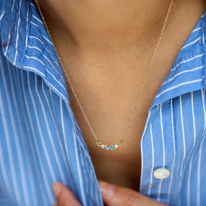 Photograph 3 of Flora Bhattachary's 14k Yellow Gold Trini Sapphire Diamond Pendant. Available on DESIGNYARD.com and in our Jewellery Shop Dublin, Ireland.