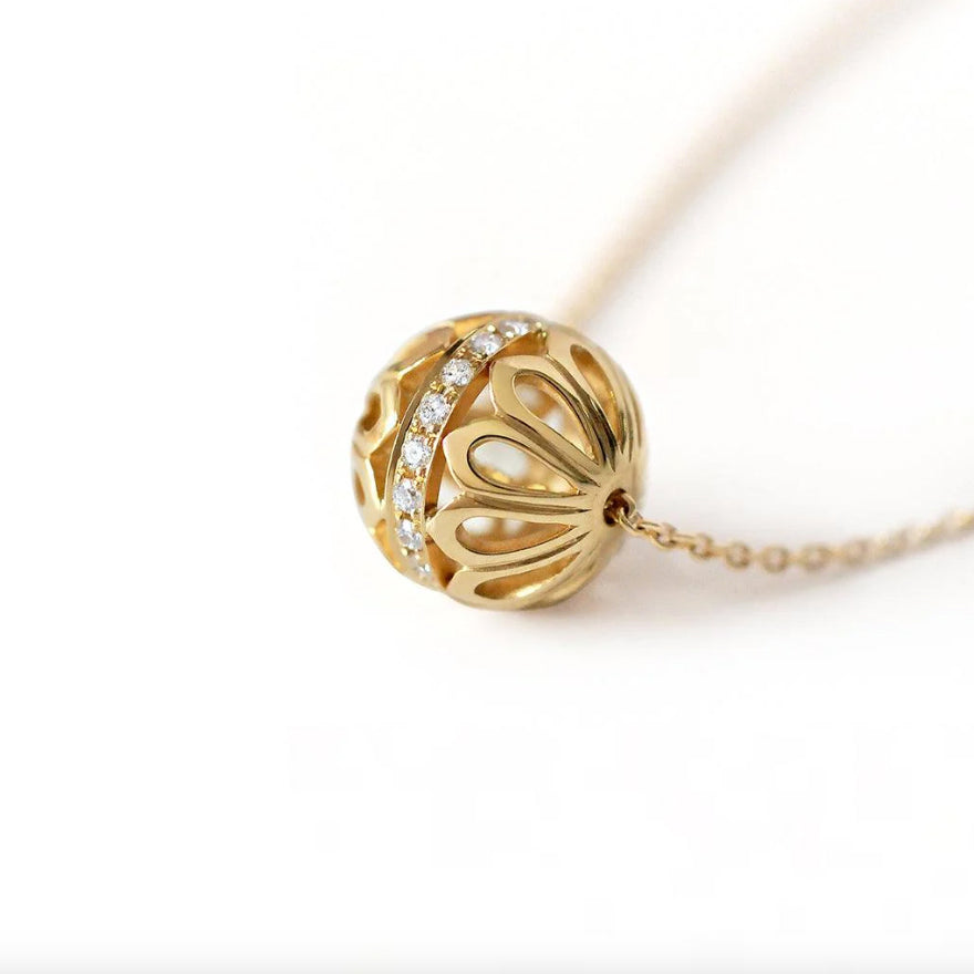 Photograph 4 of Flora Bhattachary's 14k Yellow Gold MOR Diamond Bead Pendant. Available on DESIGNYARD.com and in our Jewelry Store Dublin, Ireland.