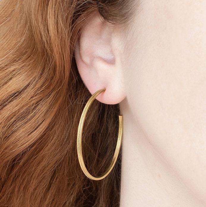 Photograph 1 of Heather O'Connor's Contemporary Silver Gold Fine Ellipse Hoop Earrings. Available on DESIGNYARD.com and in our Jewellery Shop Dublin, Ireland.