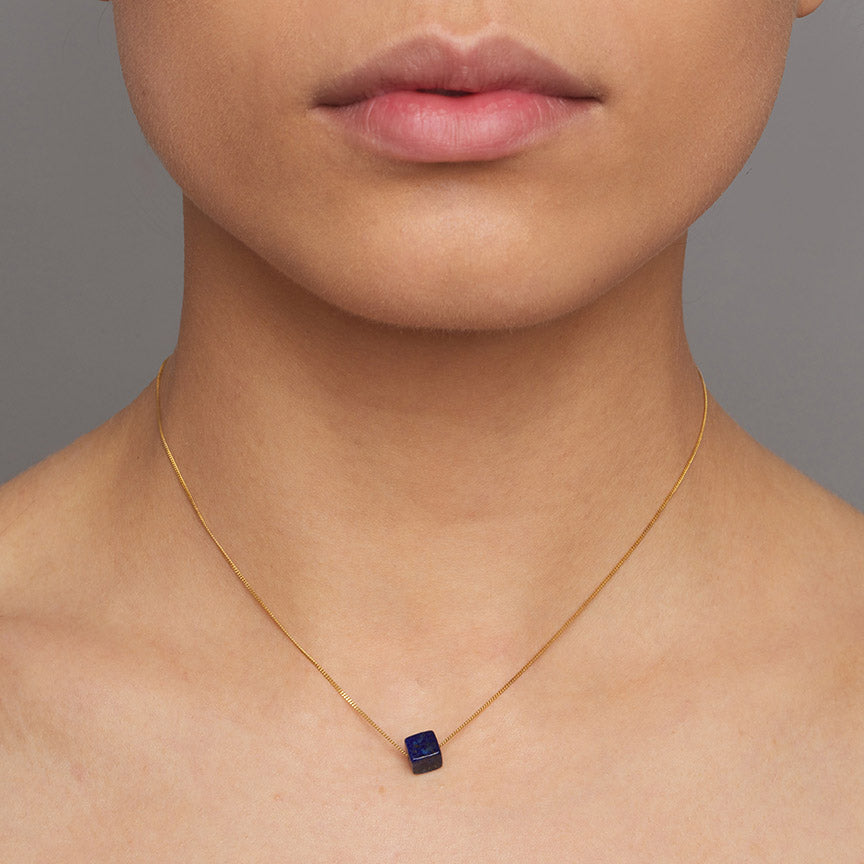 Photograph 2 of Nicole van der Wolf's Contemporary 9k Yellow Gold Lapis Lazuli Cube Necklace. Available on DESIGNYARD.com and in our Jewellery Shop Dublin, Ireland. Free Worldwide Shipping with DHL.