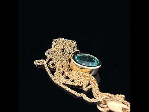 Video of Ronan Campbell's 18k Fair Trade Yellow Gold Tenues Bezəl Apatite Pendant. Available on DESIGNYARD.com and in our Jewellery Shop Dublin, Ireland. Free Worldwide Shipping with DHL.