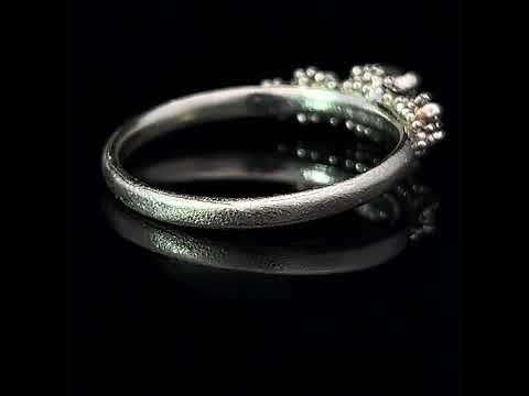 Video of Hannah Bedford's 9k White Gold Triple Cluster Green Sapphire Diamond Engagement Ring. Available on DESIGNYARD.com and in our Jewellery Shop Dublin, Ireland.