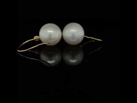 Video of Cassie McCann's 18k Yellow Gold Green Diamond Pearl Anu Drop Earrings, available on DESIGNYARD.com and in store Dublin Ireland.