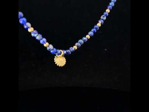 Video of Flora Bhattachary's 18k Yellow Gold Lotus Lapis Necklace. Available on DESIGNYARD.com and in our Jewellery Shop Dublin, Ireland.