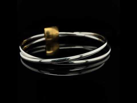 Video of Heather O'Connor's Contemporary Silver Yellow Gold Plated Double Pillow Bracelet. Available on DESIGNYARD.com and in our Jewellery Shop Dublin, Ireland.