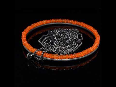 Video of Sophia Epp's Contemporary Oxidised Silver Round Fire Opal Long Statement Necklace. Available on DESIGNYARD.com and in our Jewellery Shop Dublin, Ireland. Free Worldwide Shipping with DHL.