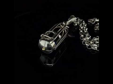 Video of Friederike Grace's Contemporary Sterling Silver 18k Yellow Gold Blue Agate Bird Cage Necklace. Available on DESIGNYARD.com and in our Jewellery Shop Dublin, Ireland.