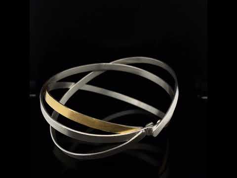 Video of Manu's Contemporary Sterling Silver 22k Yellow Gold Bi-Metal Dancing Ribbons Bracelet. Available on DESIGNYARD.com and in our Jewelry Store Dublin, Ireland. Free Worldwide Shipping with DHL