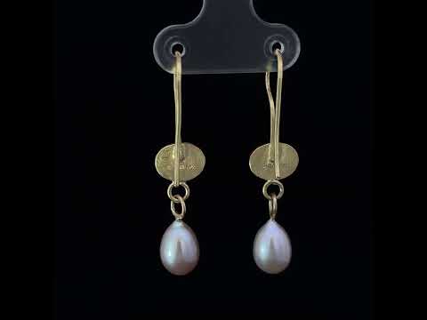 Video of Catherine Mannheim's 18k Yellow Gold Peridot Pearl Drop Statement Earrings available on DESIGNYARD.com and in store Dublin Ireland.