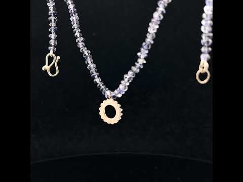 Video of Flora Bhattachary's 18k White Gold Iolite Lakshmi Necklace . Available on DESIGNYARD.com and in our Jewelry Store Dublin, Ireland.