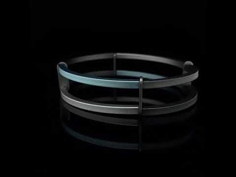 Video of Ursula Muller's Contemporary Light Blue Grey Structured Steel Aluminium Bracelet. Available on  DESIGNYARD.com and in our Jewellery Shop Dublin, Ireland. Shipping Worldwide.