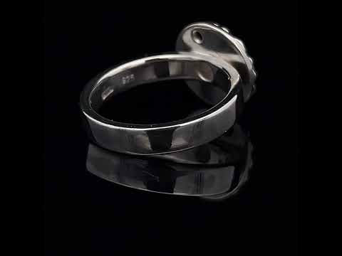 Video of Cassie Mc Cann's Contemporary 18k Yellow Gold Silver Blue Topaz Sunflower Ring. Available on DESIGNYARD.com and in our Jewellery Shop Dublin, Ireland. Free Worldwide Shipping with DHL.