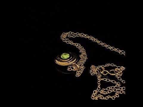 Video of Kate Smith's Contemporary Silver Gold Plated Peridot Swirl Pendant. Available on DESIGNYARD.com and in our Jewellery Shop Dublin, Ireland. Free Worldwide Shipping with DHL.