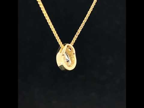 Video of Ronan Campbell's 18k Fair Trade Yellow Gold Tenues Bezəl Pear Brilliant Diamond Pendant. Available on DESIGNYARD.com or in our Jewelry Store Dublin, Ireland.