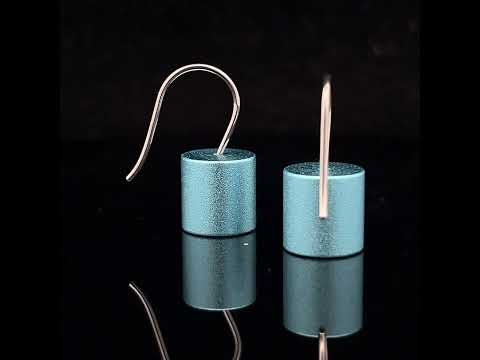 Video of Ursula Muller's Contemporary Light Blue Aluminium Roller Earrings. Available on DESIGNYARD.com and in our Jewellery Shop Dublin, Ireland. Shipping Worldwide.