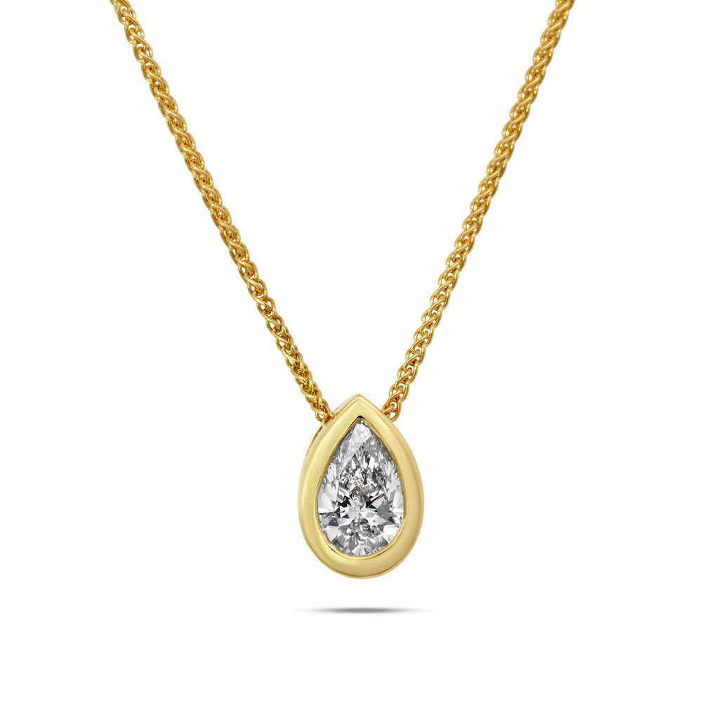 Photograph 1 of Ronan Campbell's 18k Fair Trade Yellow Gold Tenues Bezəl Pear Brilliant Diamond Pendant. Available on DESIGNYARD.com or in our Jewelry Store Dublin, Ireland.