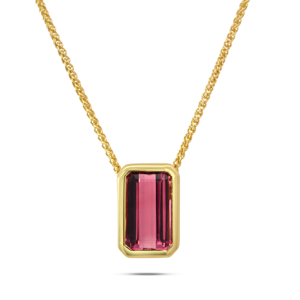 Photograph 1 of Ronan Campbell's 18k Fair Trade Yellow Gold Tenues Bezəl Brazilian Pink Tourmaline Pendant. Available on DESIGNYARD.com and in our Jewellery Shop Dublin, Ireland. Free Worldwide Shipping with DHL.