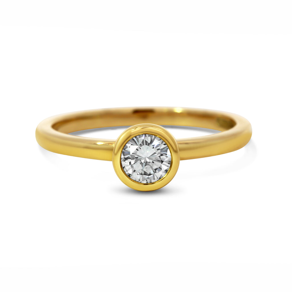 Photograph 1 of Ronan Campbell's 18k Yellow Gold Mēdēəm Bezəl Round Diamond Engagement Ring. Available on DESIGNYARD.com and in our Jewellery Shop Dublin, Ireland. Free Worldwide Shipping with DHL. 