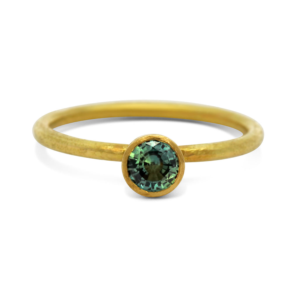 Photograph 1 of Shimara Carlow's Contemporary 18k Yellow Gold Gum Nut Solitaire Teal Sapphire Engagement Ring. Available on DESIGNYARD.com and in our Jewellery Shop Dublin, Ireland. Free Worldwide Shipping with DHL.