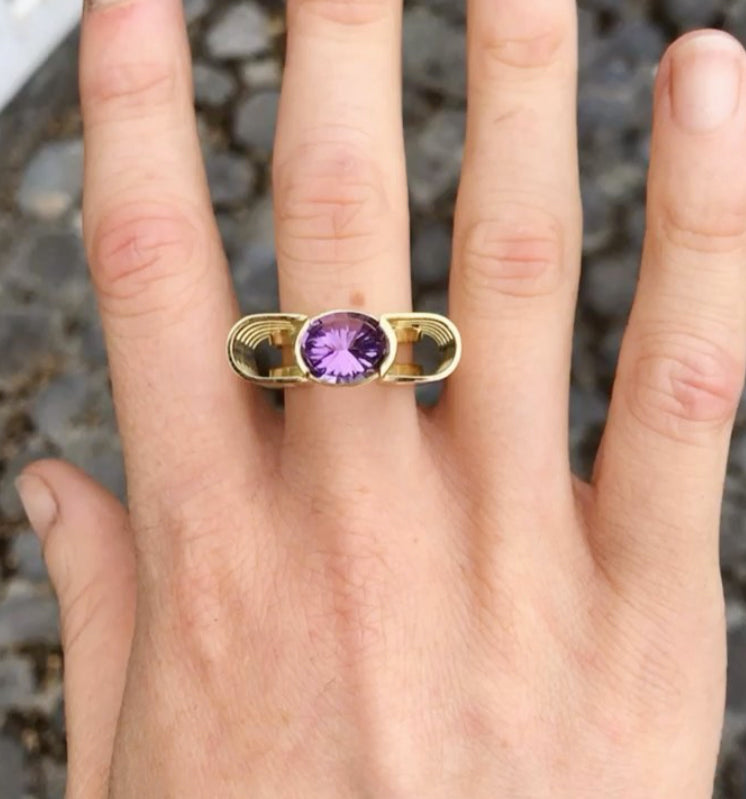 Photograph 2 of Siobhan McArdle's Contemporary 18k Yellow Gold Amethyst Neoteric Reverie Statement Ring. Available on DESIGNYARD.com and in our Jewellery Shop Dublin, Ireland. Free Worldwide Shipping with DHL.