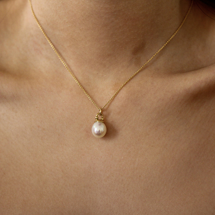 Photograph 3 of Cassie McCann's Irish Made Elegant Yellow Gold Pearl Athena Pendant. Available on DESIGNYARD.com and in our Jewellery Shop Dublin, Ireland.