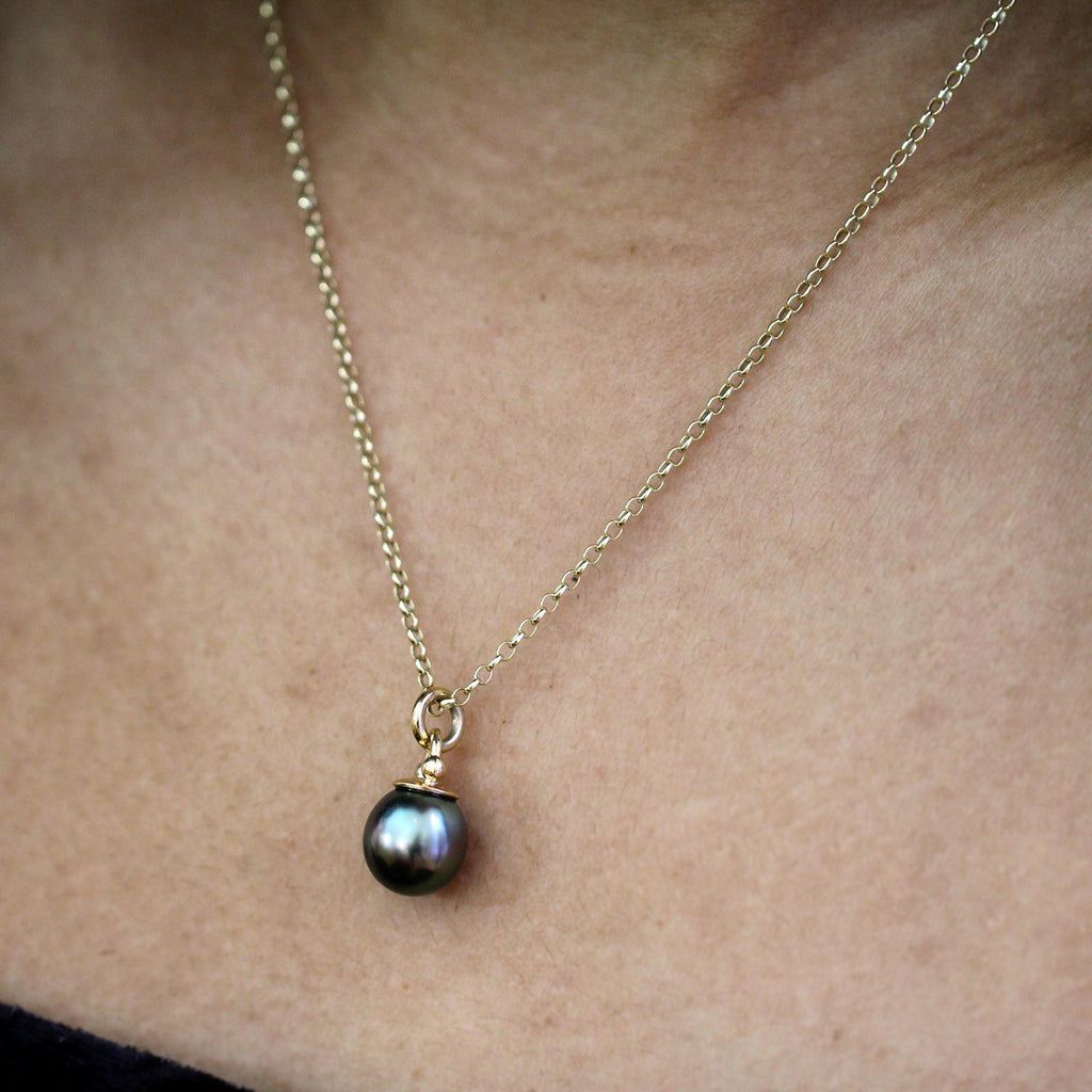 Photograph 2 of Cassie McCann's Irish Made Yellow Gold Tahitian Pearl Athena Pendant. Available on DESIGNYARD.com and in our Jewellery Shop Dublin, Ireland.