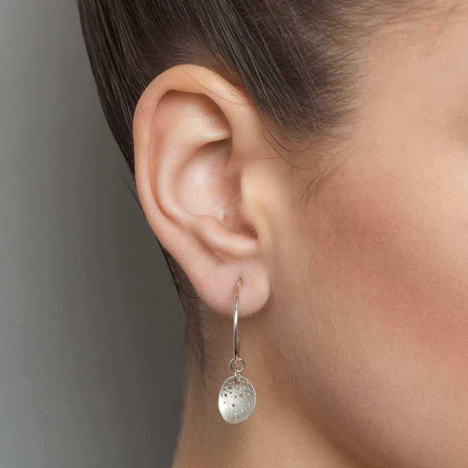 Photograph 1 of Kate Smith's Contemporary Sterling Silver Spotty Hoop Earrings. Available on DESIGNYARD.com and in our Jewellery Shop Dublin, Ireland. Shipping Worldwide with DHL.