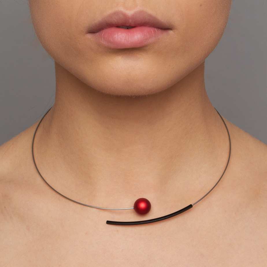 Photograph 2 of Ursula Muller's Contemporary Red Ball Aluminium Stainless Steel Statement Necklace. Available on DESIGNYARD.com and in our Jewellery Shop Dublin, Ireland. Worldwide Shipping.